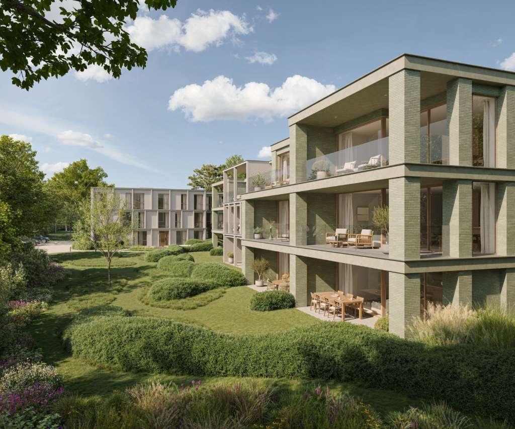 Buitenaanzicht van de residenties van Huyze Verde met groene parkomgeving in Waregem
