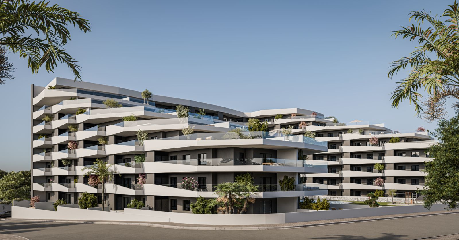 Outdoor pool and communal garden at new build apartments in San Miguel de Salinas